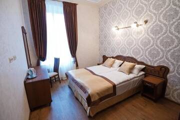 Фото номера Семейный люкс с 2 спальнями Отель Mini-Hotel Guest House Inn Lviv г. Львов 10