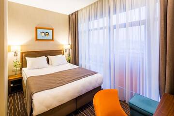 Фото номера Стандартный двухместный номер с 1 кроватью Отель Taurus City Hotel г. Львов 10