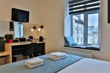 Фото номера Улучшенный четырехместный номер Апартаменты Apartment and Rooms TimetoSmile г. Львов 15